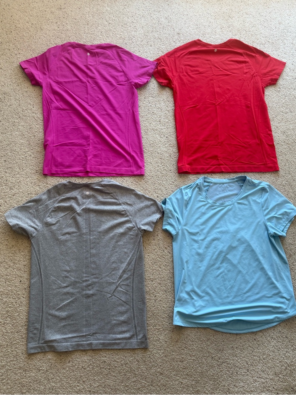Four workout tops, women’s